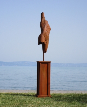 Torso male on column rusty iron